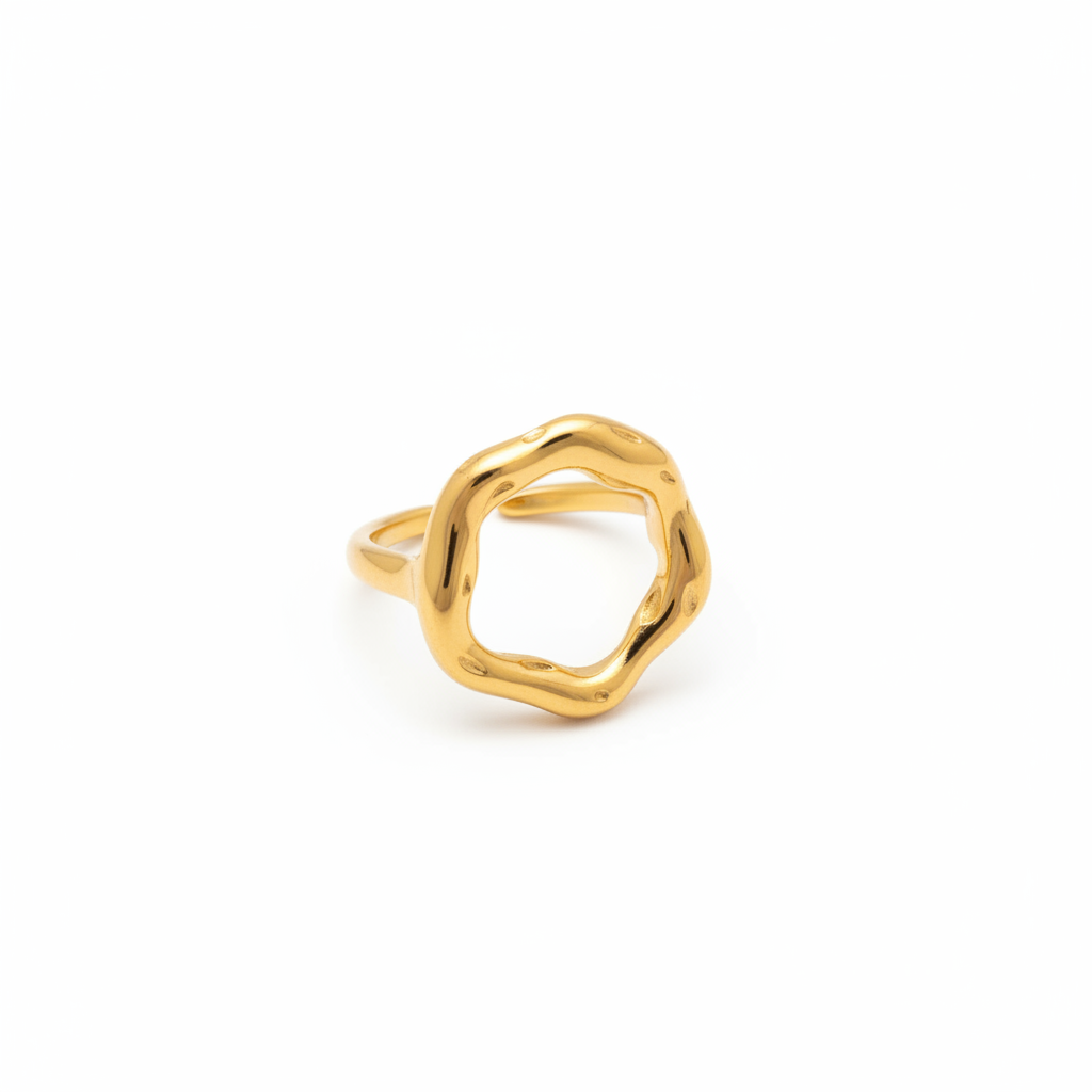 Gold ring with a geometric design on a white background