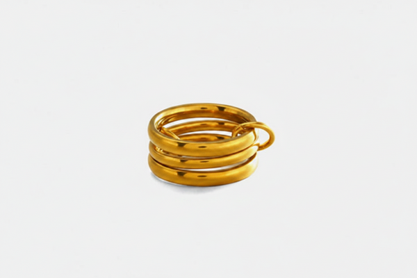 A gold-colored stainless steel ring set with dimension annotations showing an inner diameter of 1.7cm and a width of 0.