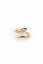 Gold snake-shaped ring on a white background