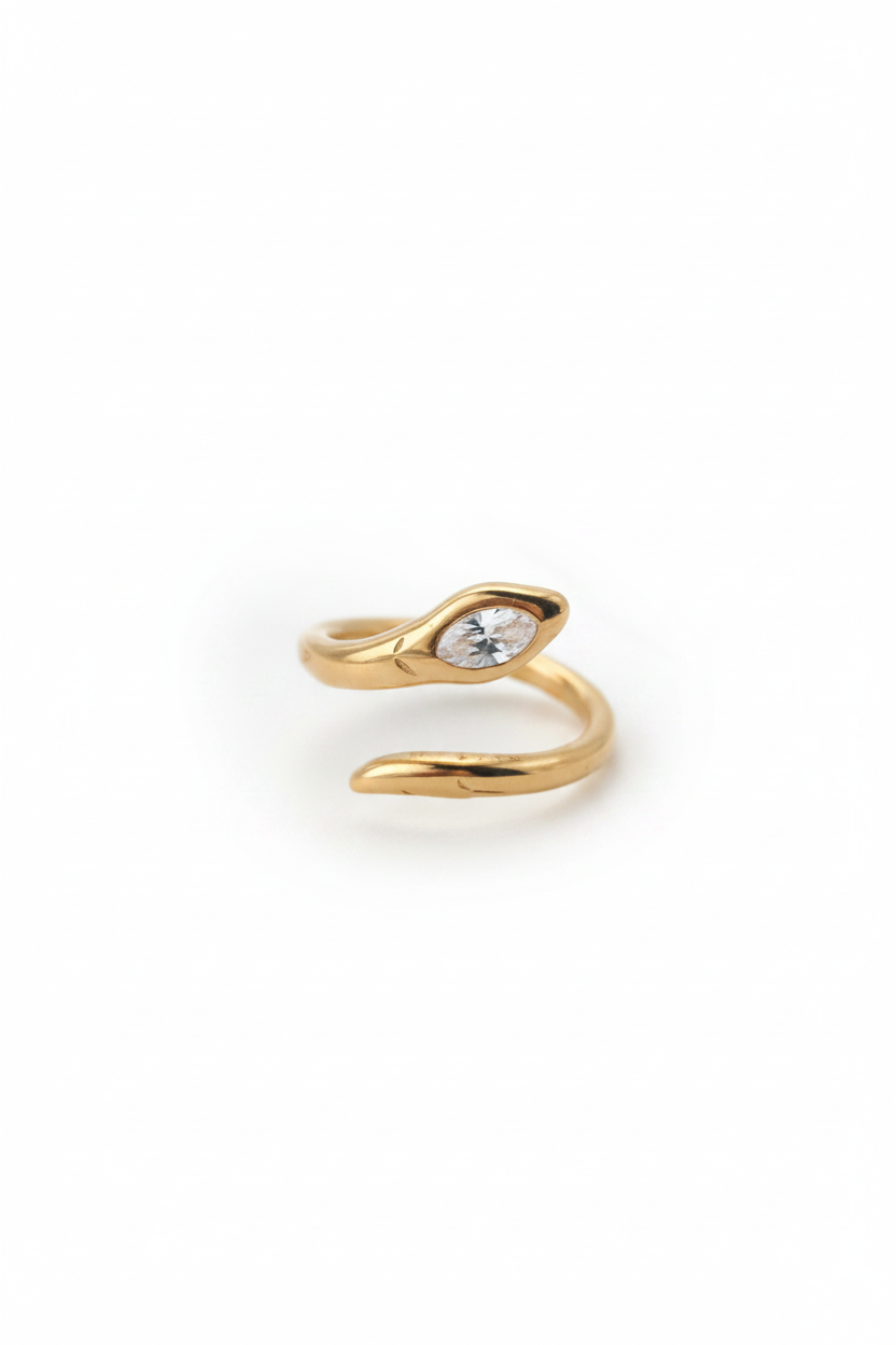 Gold snake-shaped ring on a white background