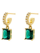 Gold hoop earrings with green gemstones on a white background