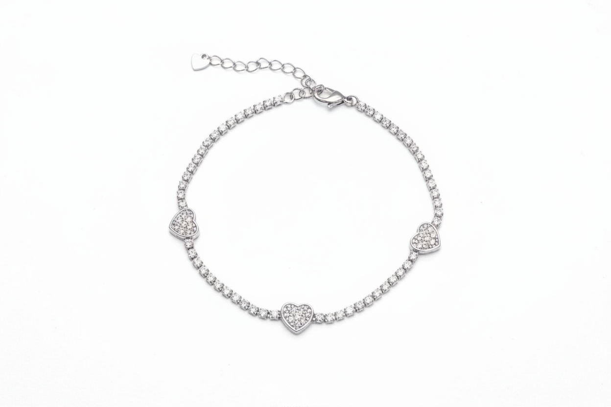 Silver bracelet with heart-shaped clasp on a white background