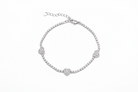Silver bracelet with heart-shaped clasp on a white background