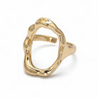Gold ring with a unique design on a white background