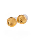 Pair of gold shell-shaped earrings on a white background