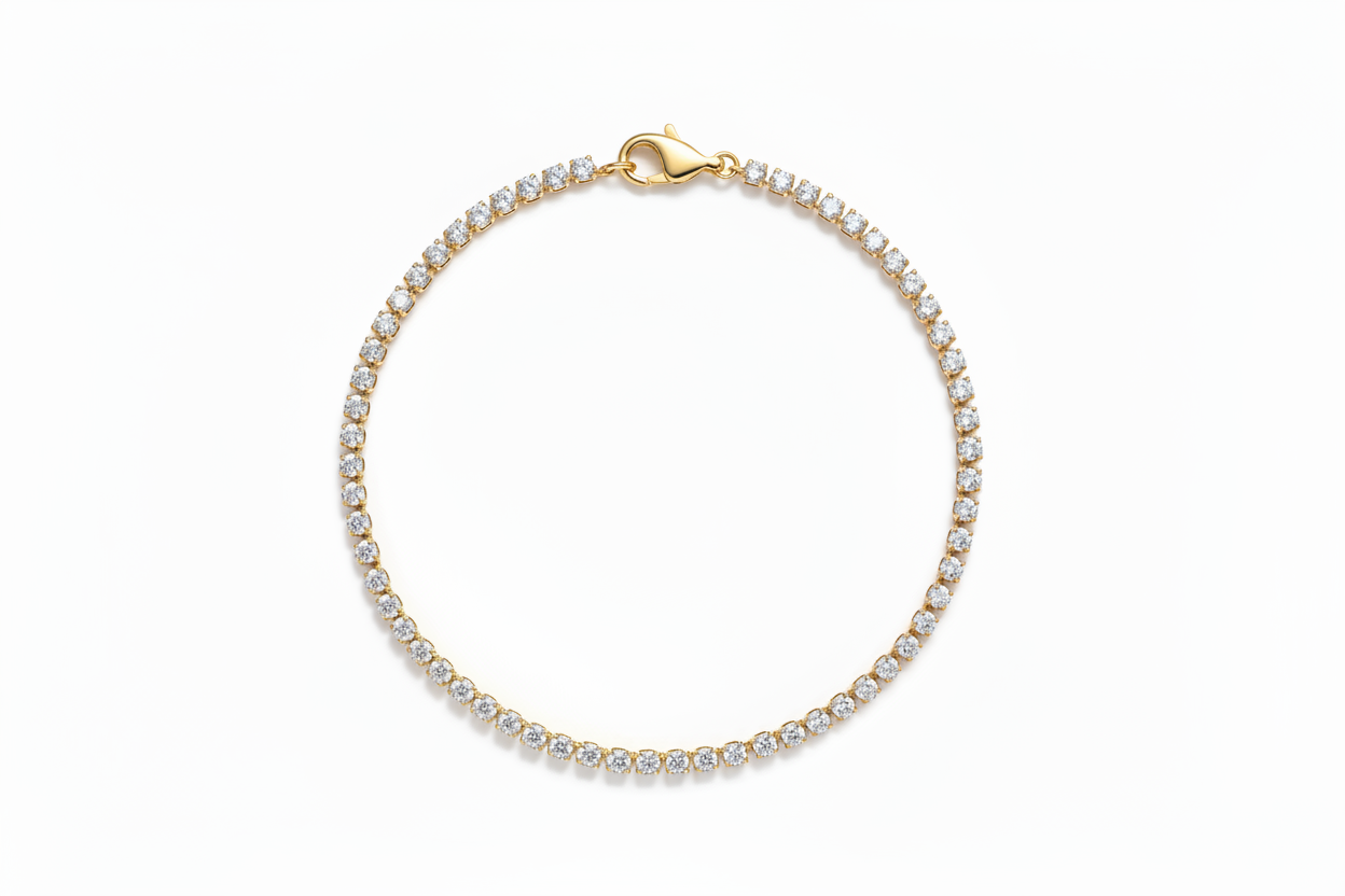 Gold bracelet with clear stones on a white background