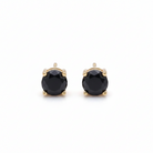 Pair of black gemstone stud earrings with gold posts on a white background