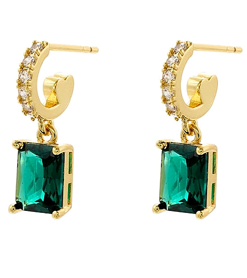 Gold hoop earrings with green gemstones on a white background