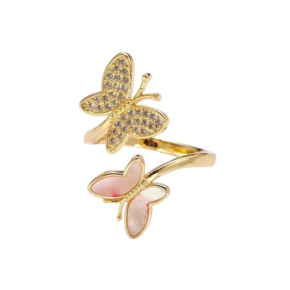 Gold butterfly-shaped rings on a white background