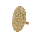Gold textured ring on a white background