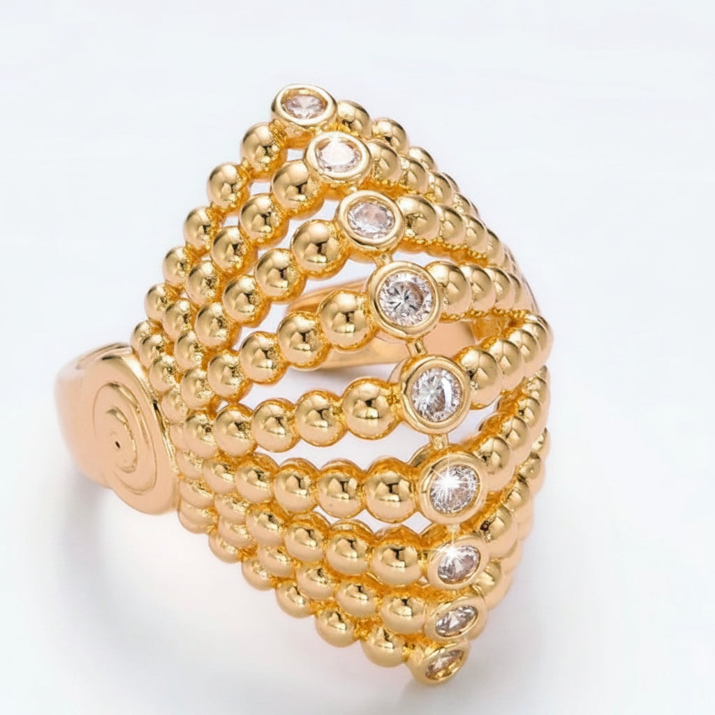 Gold ring with diamond accents on a white background