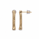 A pair of gold-toned bone-shaped stud earrings with a textured finish, shown on a plain white background. One earring is facing forward, and the other is turned to show the post and butterfly back.