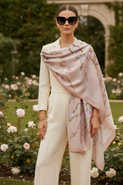 Woman wearing a floral scarf in a garden setting