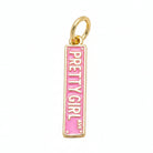 A rectangular gold charm pendant with a pink enamel background and the words 'PRETTY GIRL AV.' printed vertically in gold, shown on a plain white background.