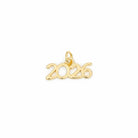 A gold charm spelling out the year '2026' in a cursive, openwork font, complete with a small hanging loop at the top, shown on a solid light blue background.