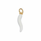 A small white curved charm or pendant with a gold-tone ring attachment, photographed on a plain light blue background.