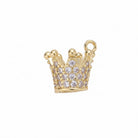A gold crown-shaped jewelry charm or pendant embellished with clear rhinestones, shown on a plain light gray background.