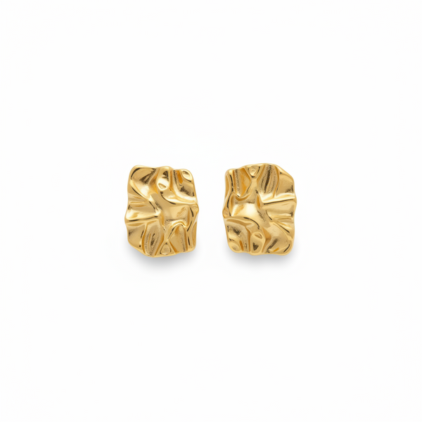 Pair of gold earrings on a white background
