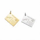 Two postcard-shaped pendant charms on a light blue background, one in gold and one in silver, both engraved with 'POST CARD' and 'I love You'.